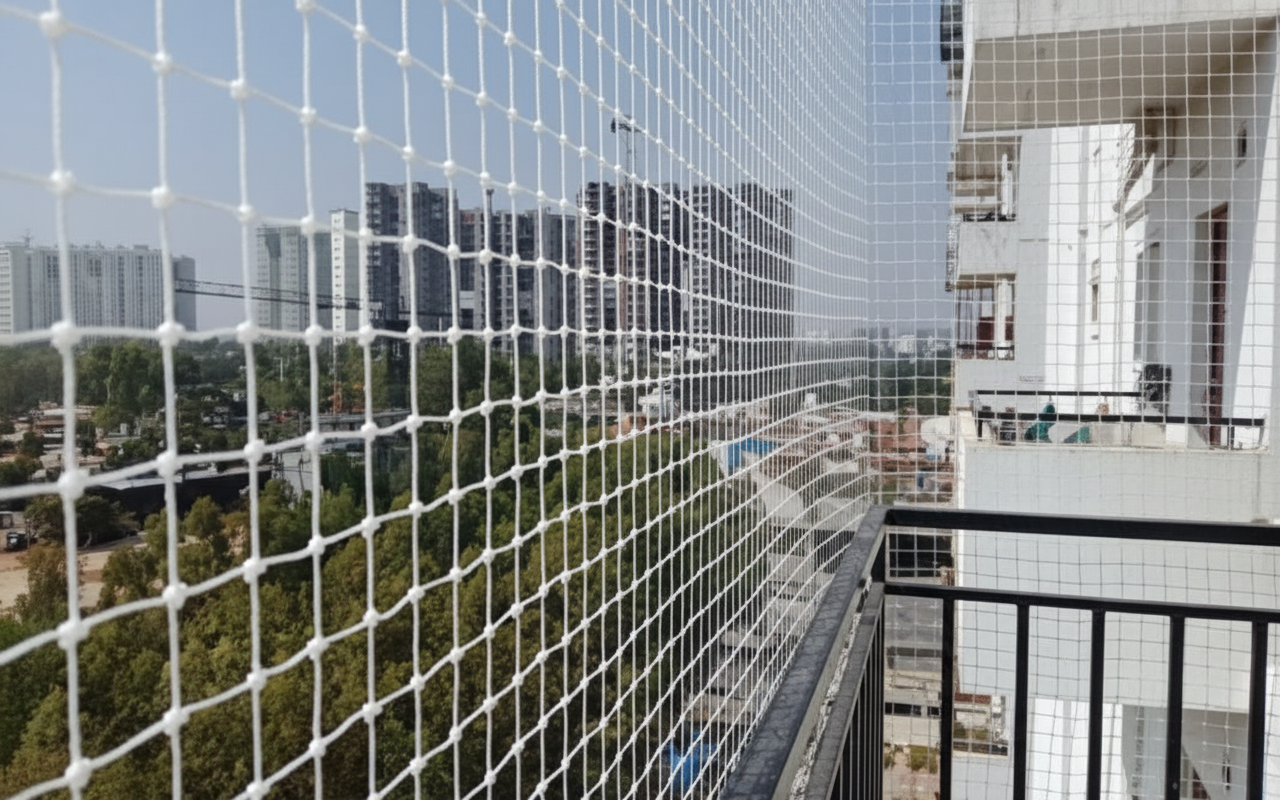 Pigeon Net Installers Team working on invisible grill installation in Coimbatore